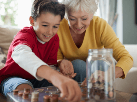 Grandmother and grandson counting coins
