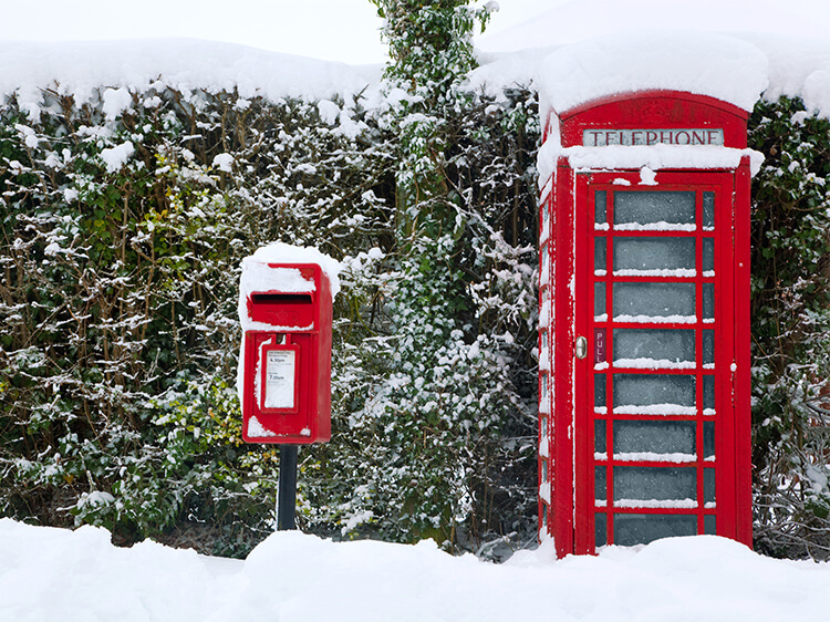 Red phone box in the snow