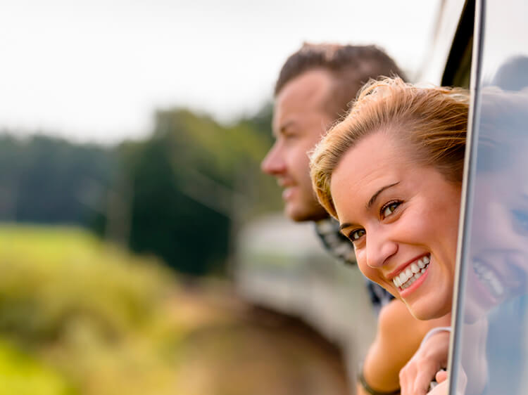 Woman looking out train window